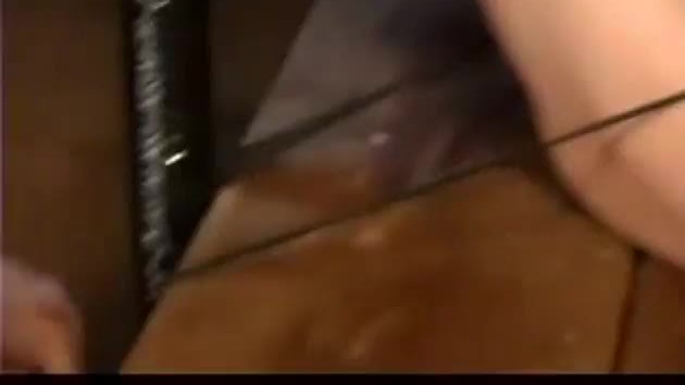 Bondaged submissive receives a pussy whipping